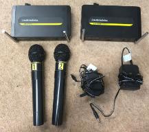 Two audio-technica wireless microphone rigs